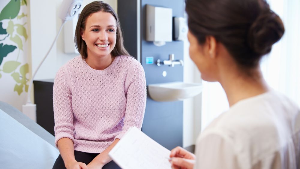 Shown is a doctor and patient discussing regenerative and hormone therapy options in La Grange Park, IL